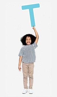 Happy boy holding the letter T