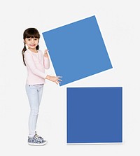 Adorable girl stacking empty square boards