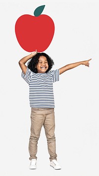 Cheerful kid with an apple
