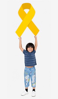 Young boy holding gold ribbon supporting childhood cancer awareness