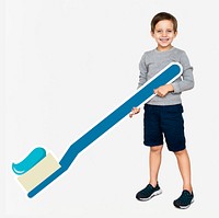 Cheerful kid holding a toothbrush