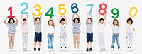 Cheerful diverse kids holding numbers one to zero