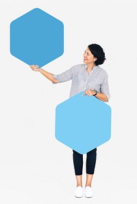 Cheerful woman showing blue hexagon shaped boards