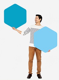 Cheerful man showing blue hexagon boards