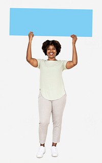 Cheerful woman showing a blank blue banner