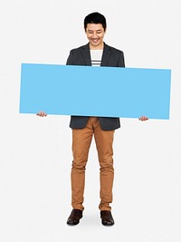 Cheerful man showing a blank blue banner