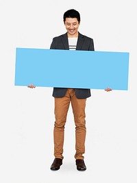 Cheerful man showing a blank blue banner