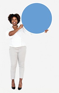 Cheerful businesswoman holding a blue round board