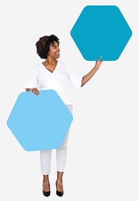 Cheerful woman showing blue hexagon shaped boards