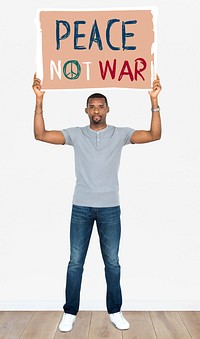 An African man holding peace not war signboard