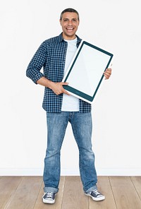 Happy man holding a tablet icon