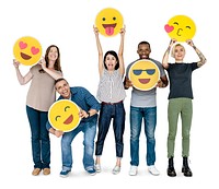 Diverse happy people holding happy emoticons