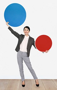 Happy woman holding round boards