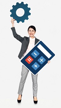 Businesswoman holding a calculator and a gear