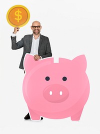 Businessman saving money in a piggy bank