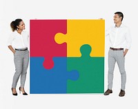 Businesspeople connecting jigsaw puzzle pieces