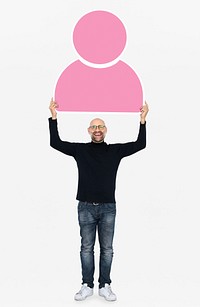 Cheerful man holding a pink user icon