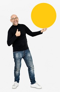 Happy man holding a yellow round board