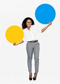 Cheerful woman holding colorful round boards