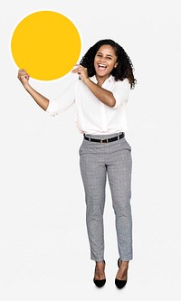 Cheerful woman holding a round yellow board