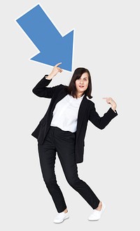 Woman holding a blue arrow and pointing to herself