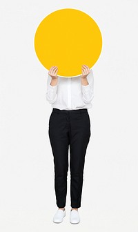 Woman holding a round yellow board