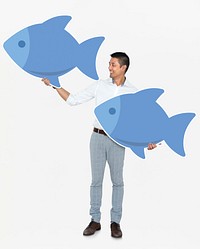 Happy man holding  blue fish icons