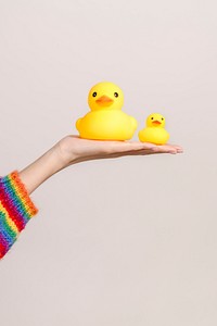 Cute rubber ducks on a hand
