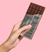 Chocolate bar in foil packaging isolated on background