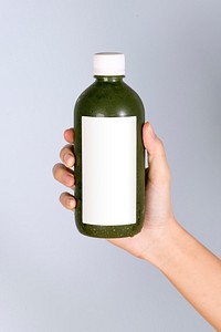 Organic green drink in a bottle with a white label