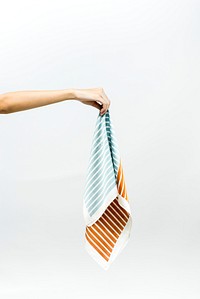 Hand picking up a striped scarf