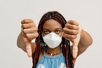 Black girl wearing an air pollution mask