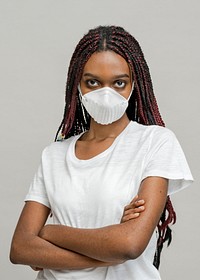 Crossed arms black woman wearing a mask