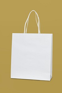 White paper bag on a dull yellow background