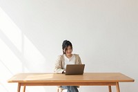 Happy Asian woman working from home 