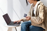 Asian woman online shopping using her laptop 
