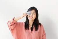 Asian woman with a credit card mockup