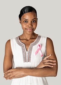 African American woman wearing a pink ribbon for brest cancer awareness