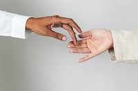 Hands of diversity coming together in unity