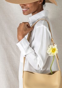 Black woman carrying a beige shoulder bag mockup 