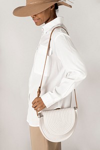 Black woman carrying a white woven cotton rope bag mockup