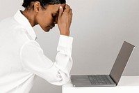 Stressed black woman using a laptop 