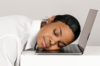 Exhausted black woman asleep on a laptop 