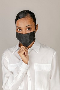 Black woman wearing a black mask