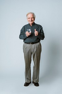 Senior man with a glass of water