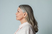 Senior woman wearing eyeglasses in a profile shot 