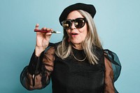 Senior woman smoking electronic cigarette