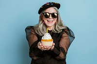 Cool grandma celebrating her birthday with a cupcake