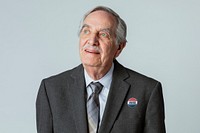 Happy businessman with a vote sticker on his suit jacket 