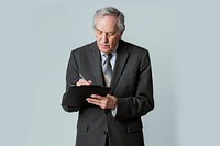 Busy businessman writing on a paper clipboard 